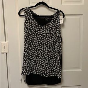 Floral asymmetrical blouse with solid black back